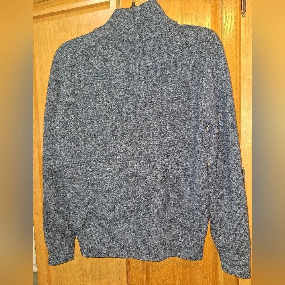A J. Crew dark grey lambs wool 1/4 zip pullover sweater in a size small.